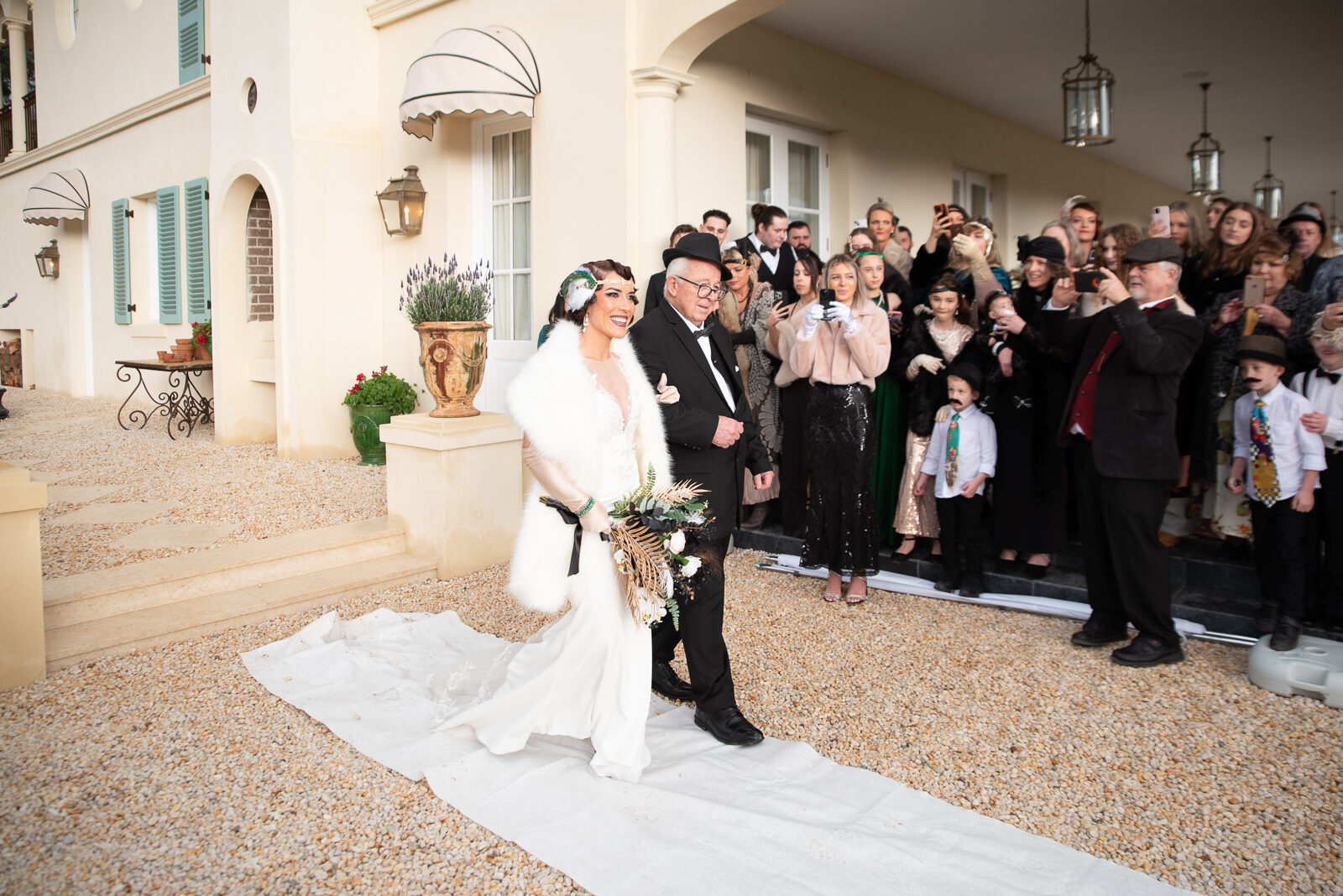 The bridal procession past the colonnade at Terre Rouge